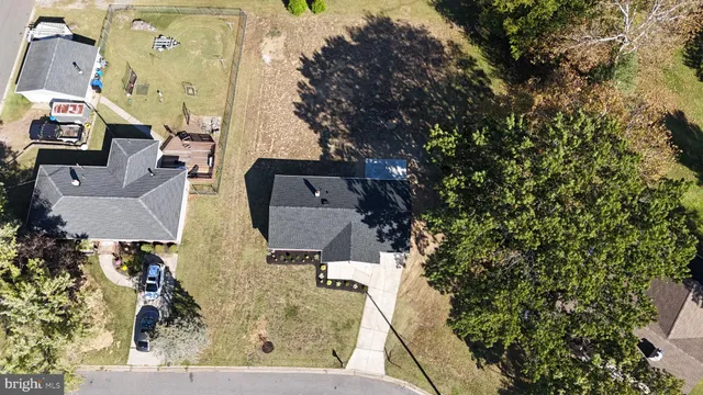 an aerial view of a house with outdoor space
