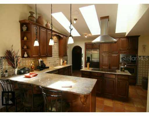 a kitchen with a sink a counter space and appliances