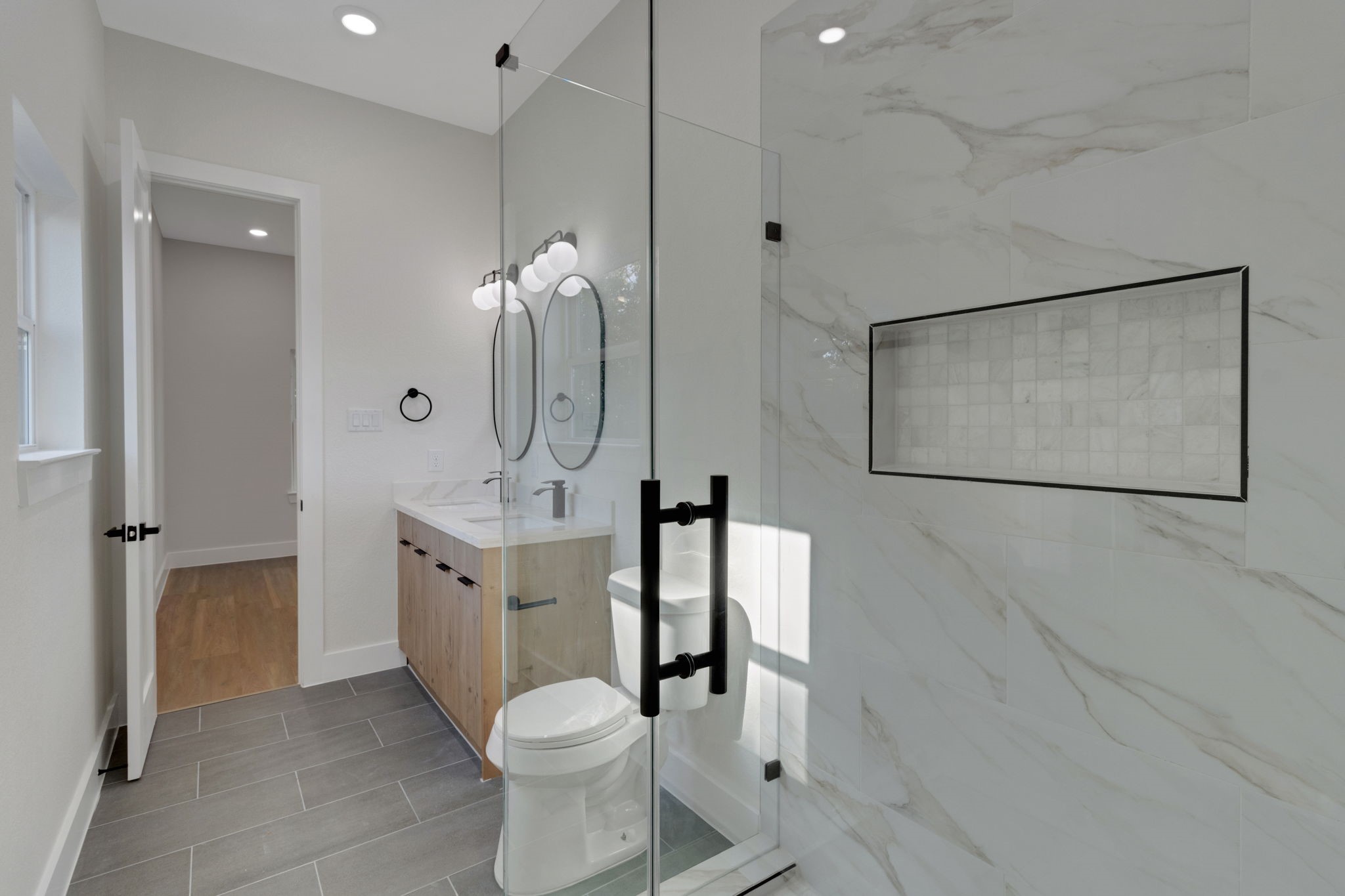 7962 Ethel Street, Unit A Houston, TX 77028 - Photo 13 of 25 a bathroom with a sink a toilet and shower