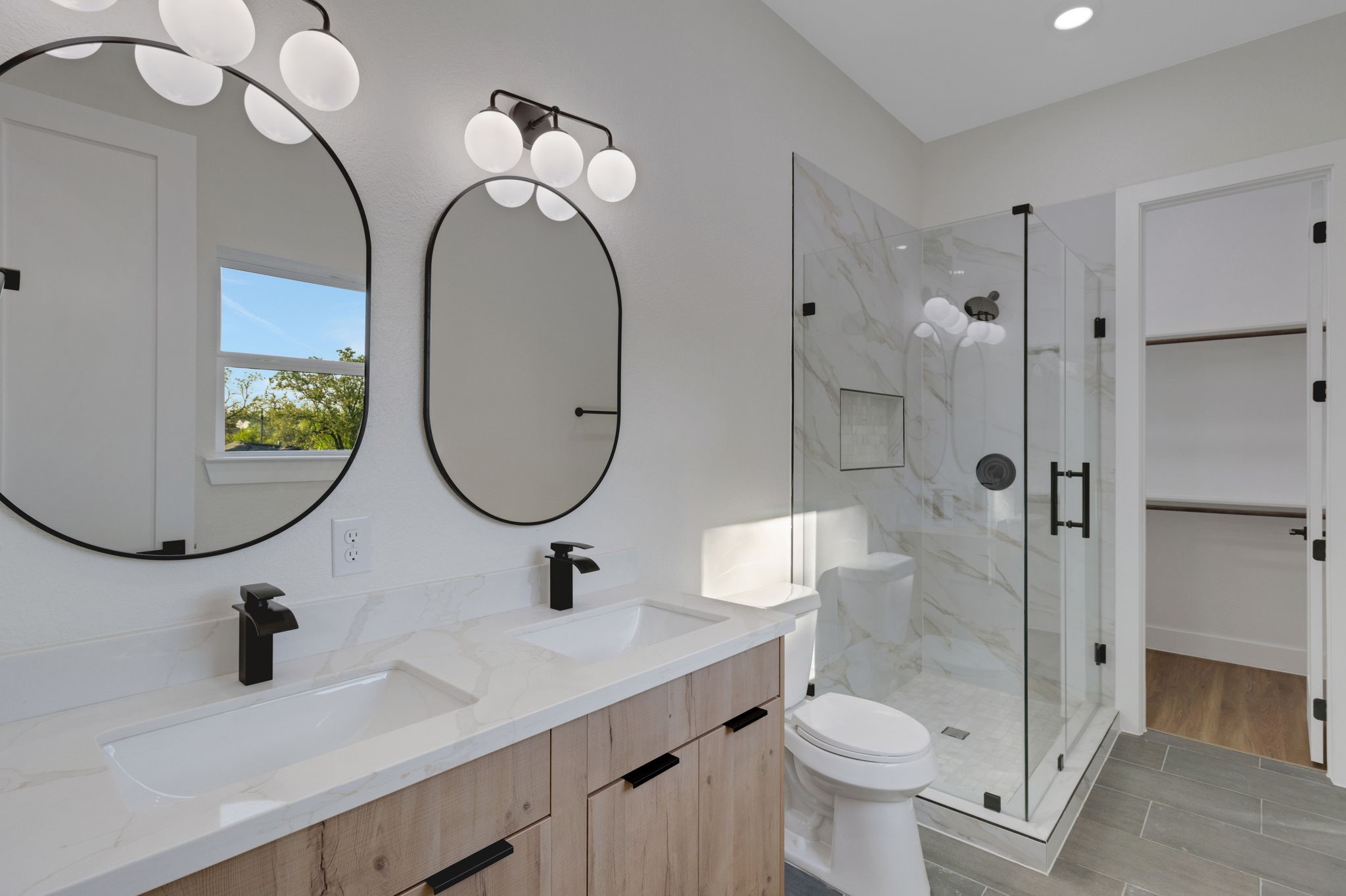 7962 Ethel Street, Unit A Houston, TX 77028 - Photo 15 of 25 a bathroom with a toilet sink and mirror