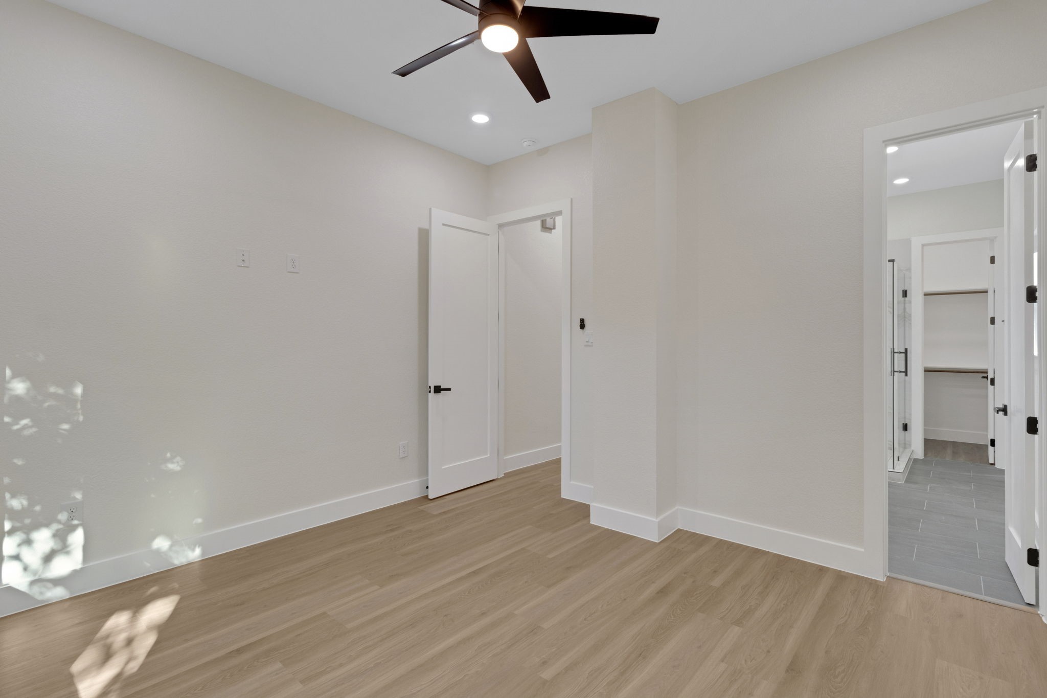 7962 Ethel Street, Unit A Houston, TX 77028 - Photo 16 of 25 a view of a room with wooden floor and a ceiling fan