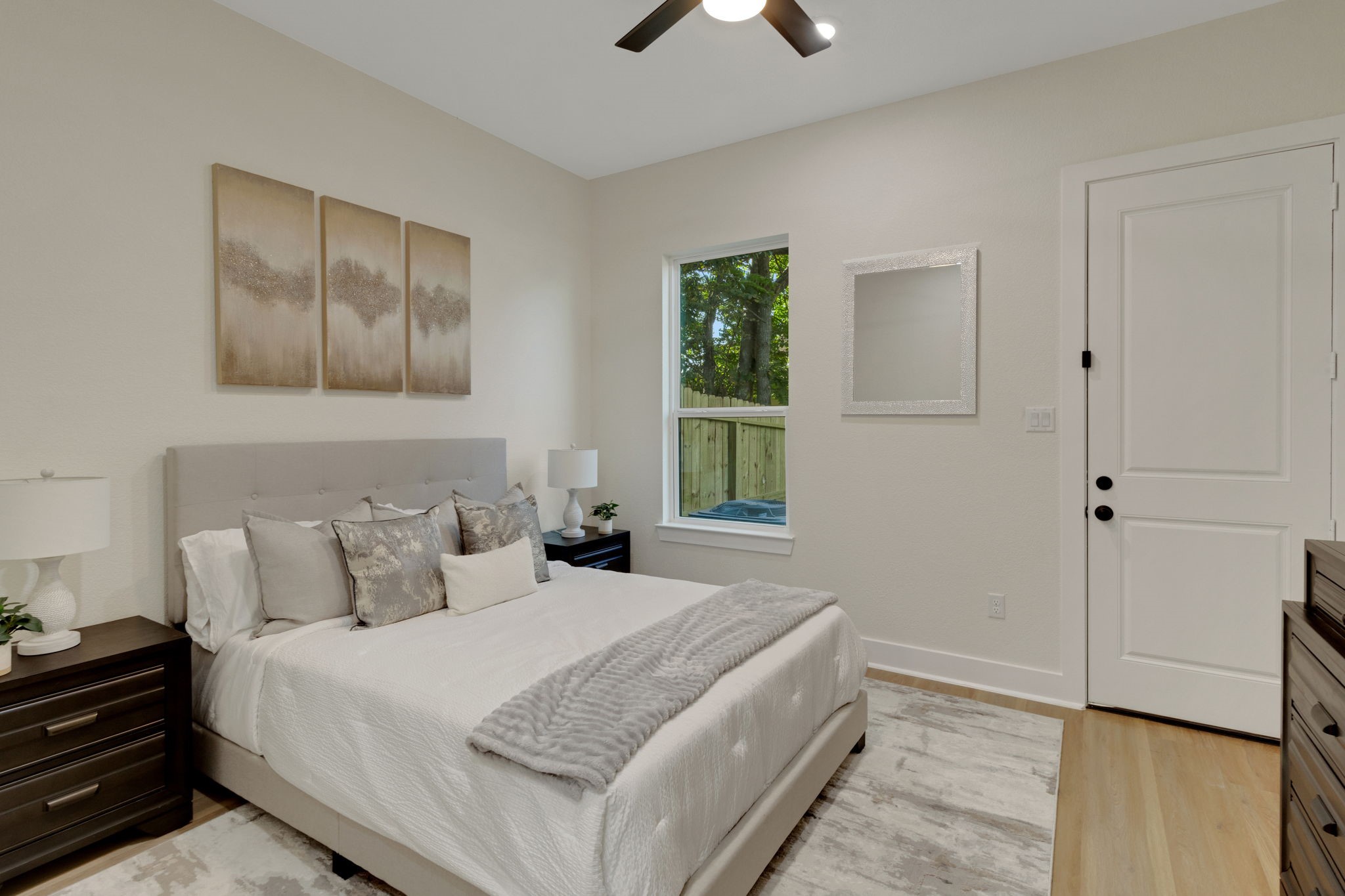 7962 Ethel Street, Unit A Houston, TX 77028 - Photo 20 of 25 a bedroom with a bed and a chandelier