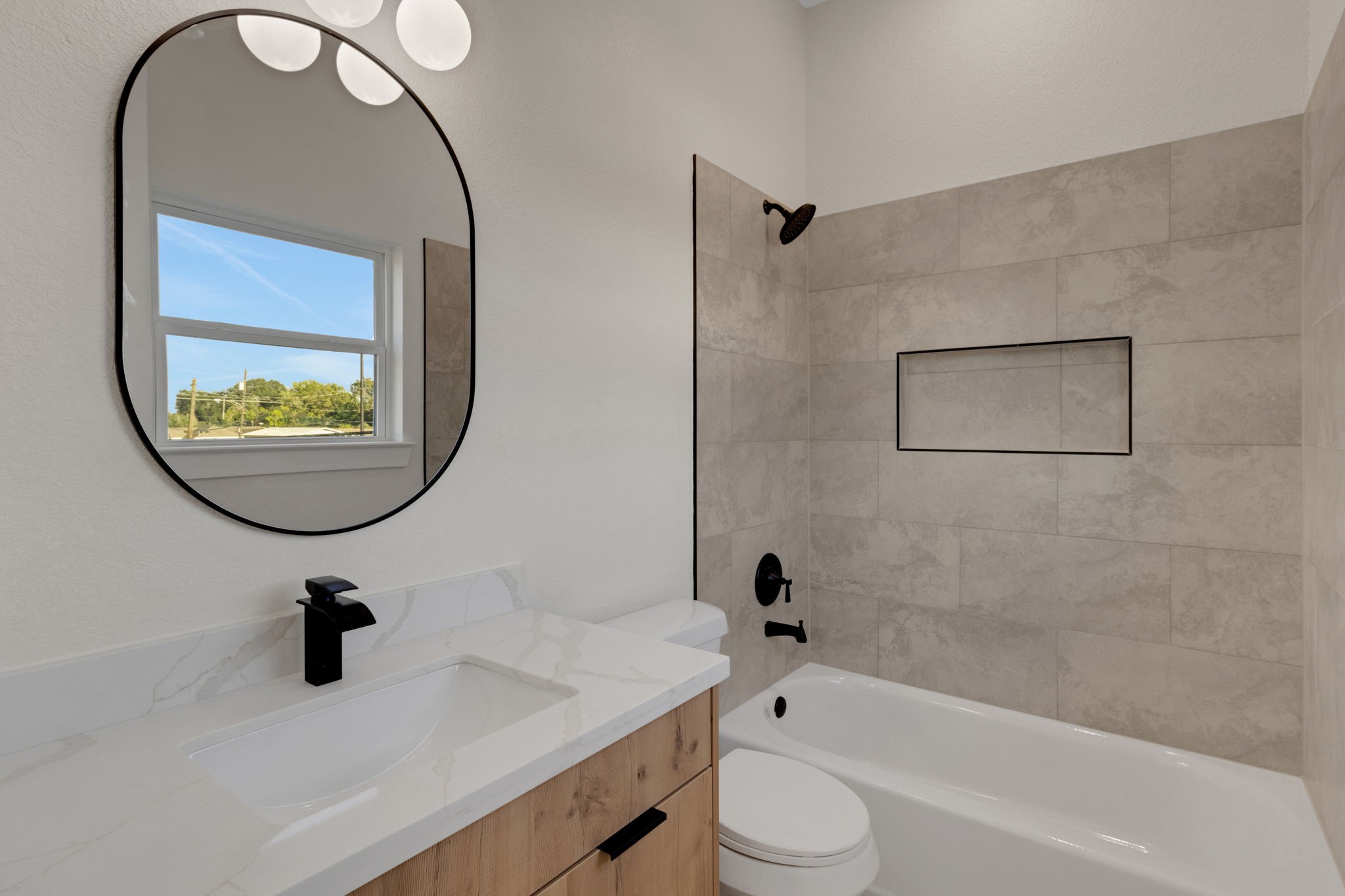 7962 Ethel Street, Unit A Houston, TX 77028 - Photo 22 of 25 a bathroom with a sink a toilet and a mirror