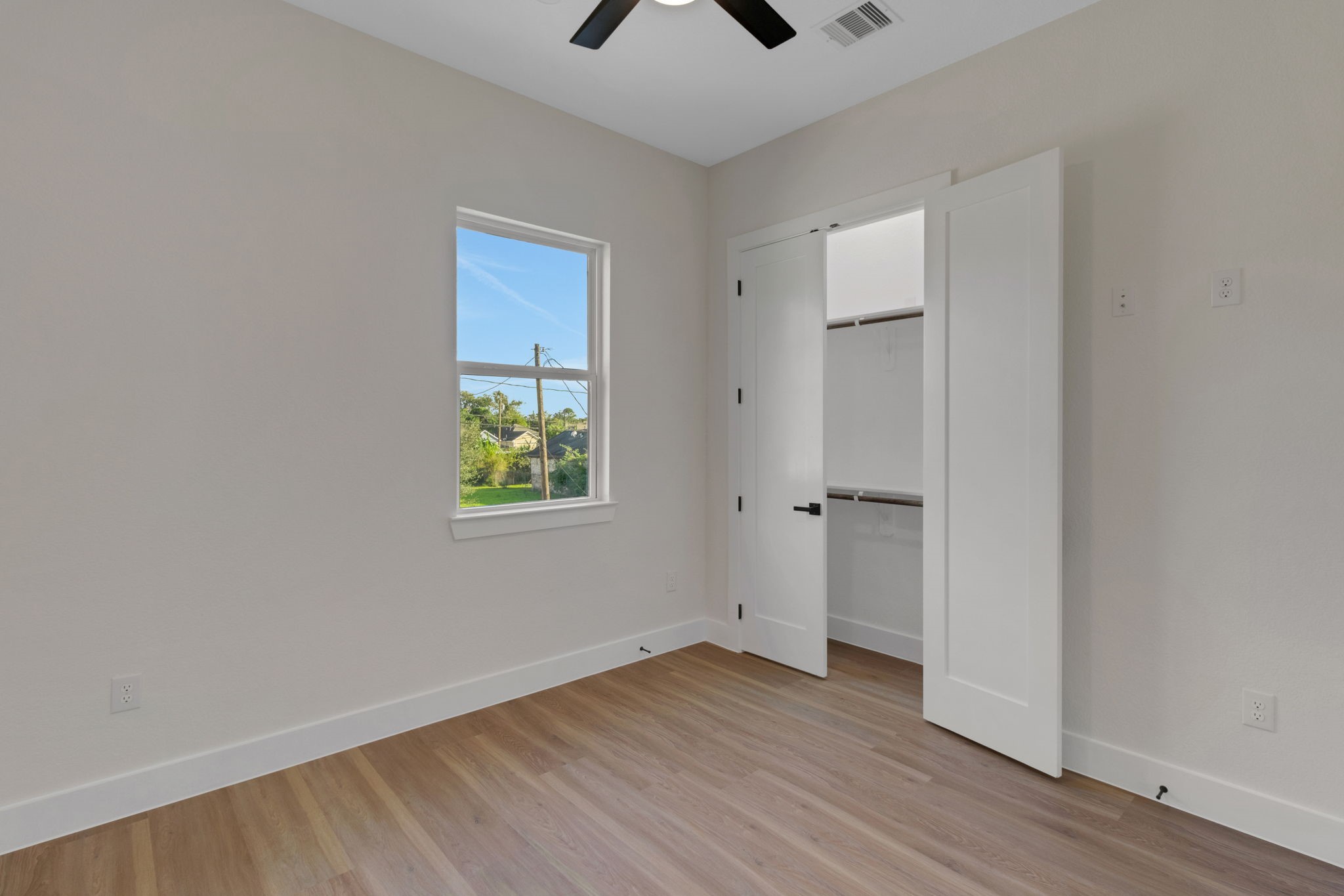 7962 Ethel Street, Unit A Houston, TX 77028 - Photo 23 of 25 a view of an empty room with window and wooden floor