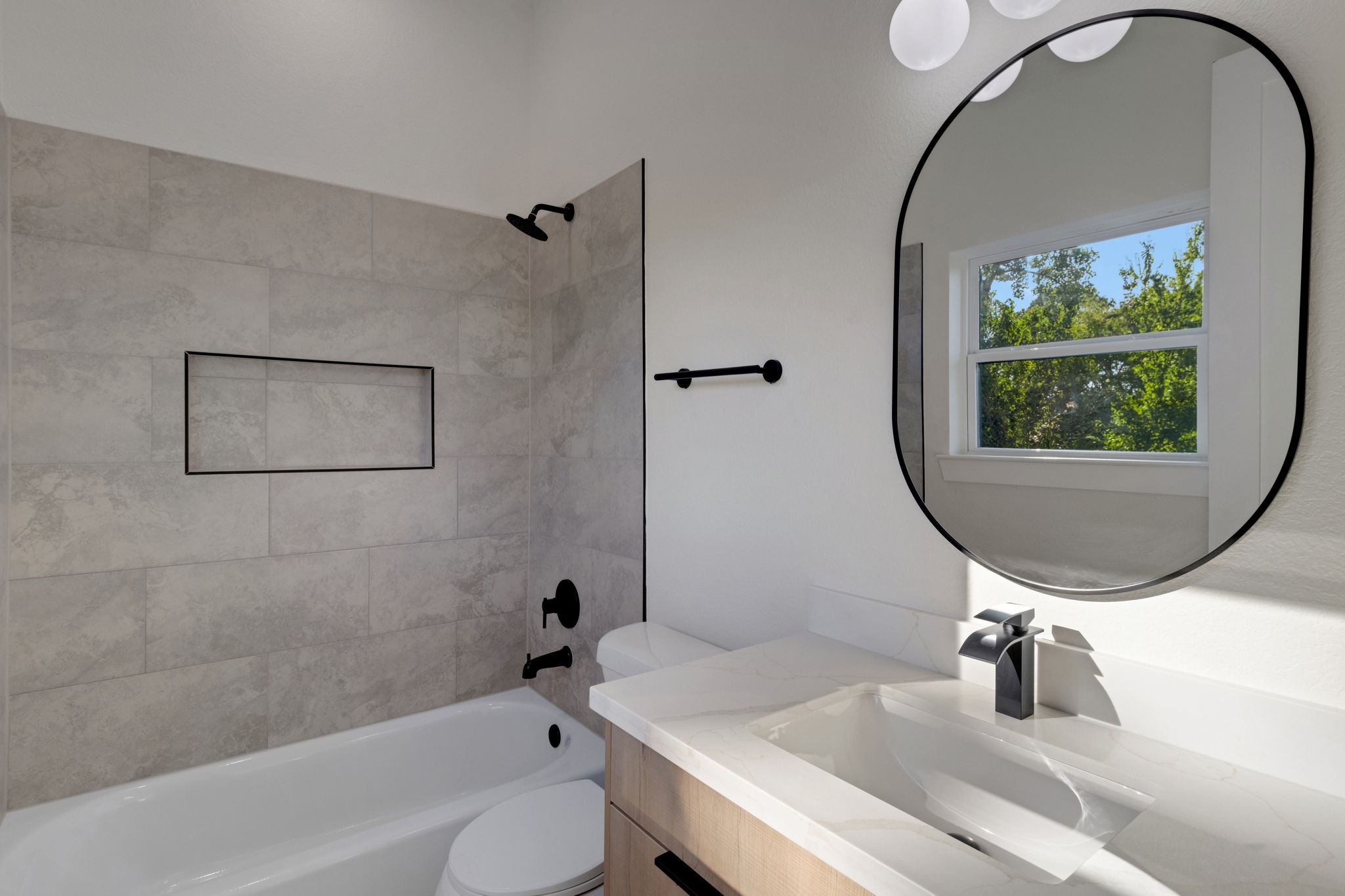 7962 Ethel Street, Unit A Houston, TX 77028 - Photo 9 of 25 a bathroom with a sink a toilet and a mirror