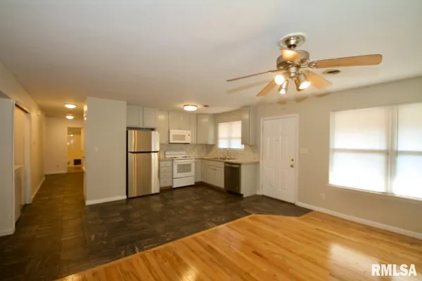 a view of a kitchen with a sink and a window
