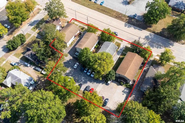 an aerial view of house with yard