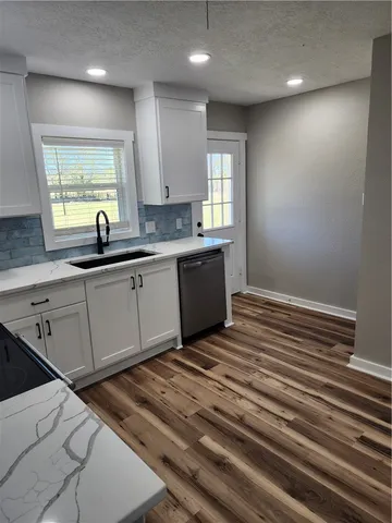a kitchen with a sink and cabinets