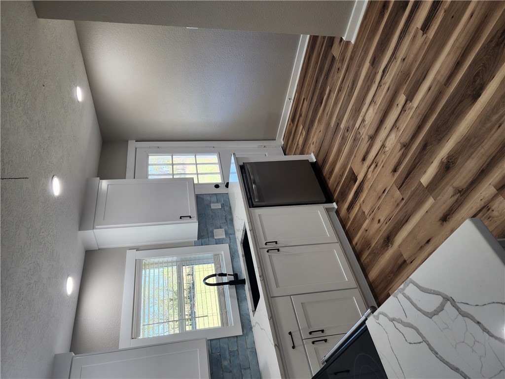 12877 East State Highway 21 Bryan, TX 77808 - Photo 14 of 48 a kitchen with a sink and cabinets