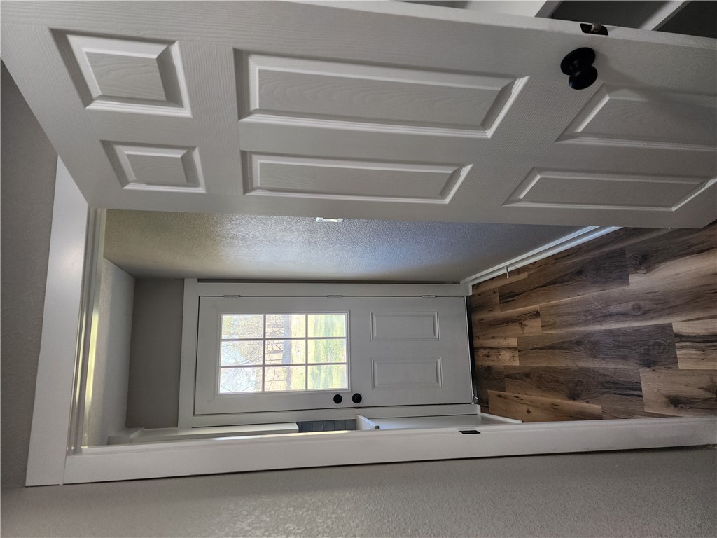 12877 East State Highway 21 Bryan, TX 77808 - Photo 16 of 48 a view of a hallway with wooden floor and a window