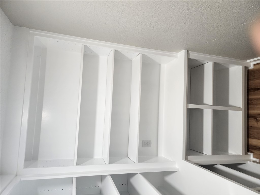 12877 East State Highway 21 Bryan, TX 77808 - Photo 19 of 48 a view of a room with shelf