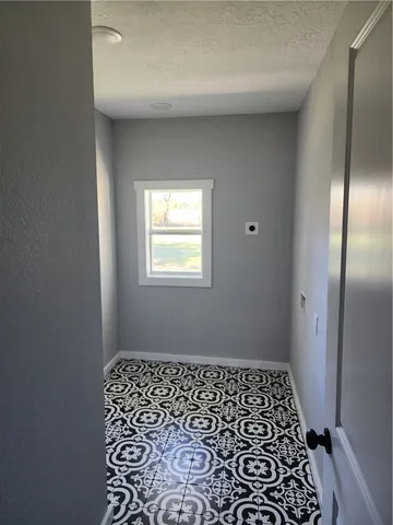 a bathroom with a double vanity sink a toilet and a mirror