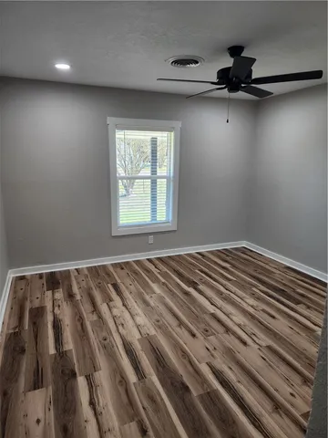 a view of a room with a ceiling fan