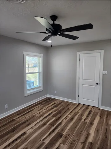 a view of a room with a ceiling fan