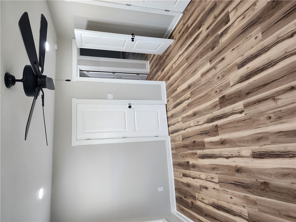 12877 East State Highway 21 Bryan, TX 77808 - Photo 41 of 48 a view of a room with wooden floor