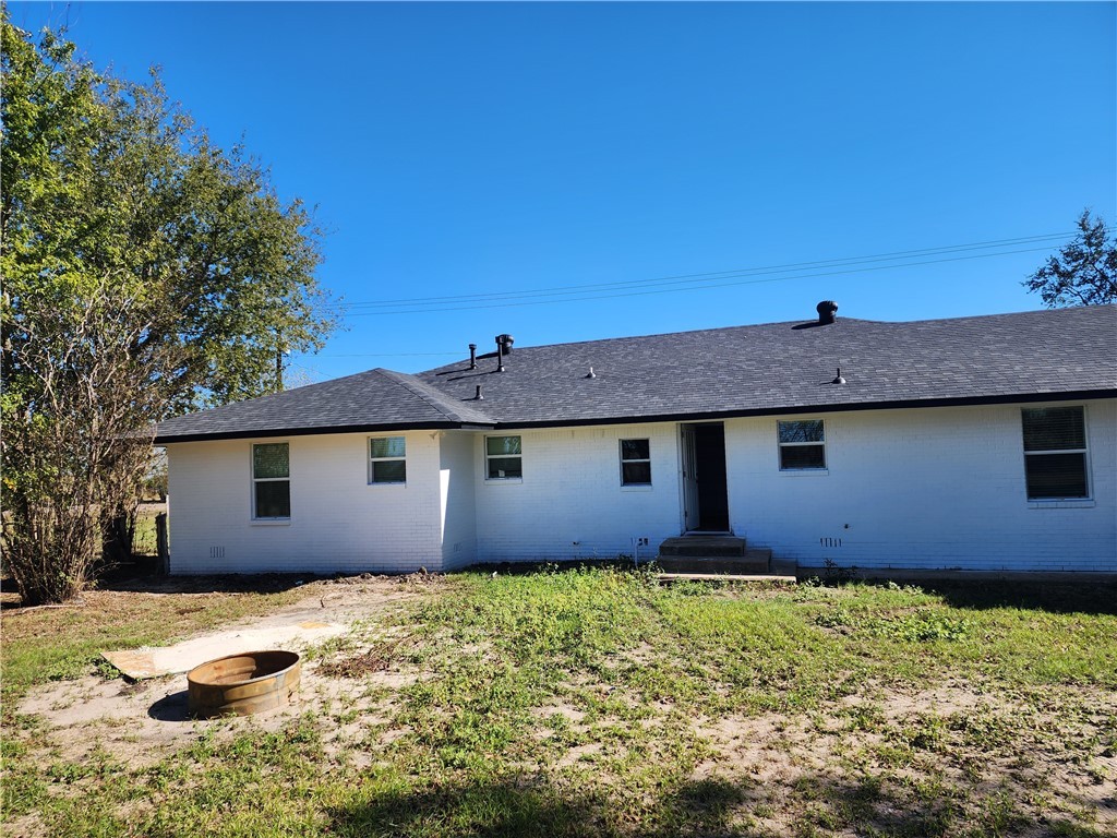 12877 East State Highway 21 Bryan, TX 77808 - Photo 44 of 48 a front view of a house with a yard