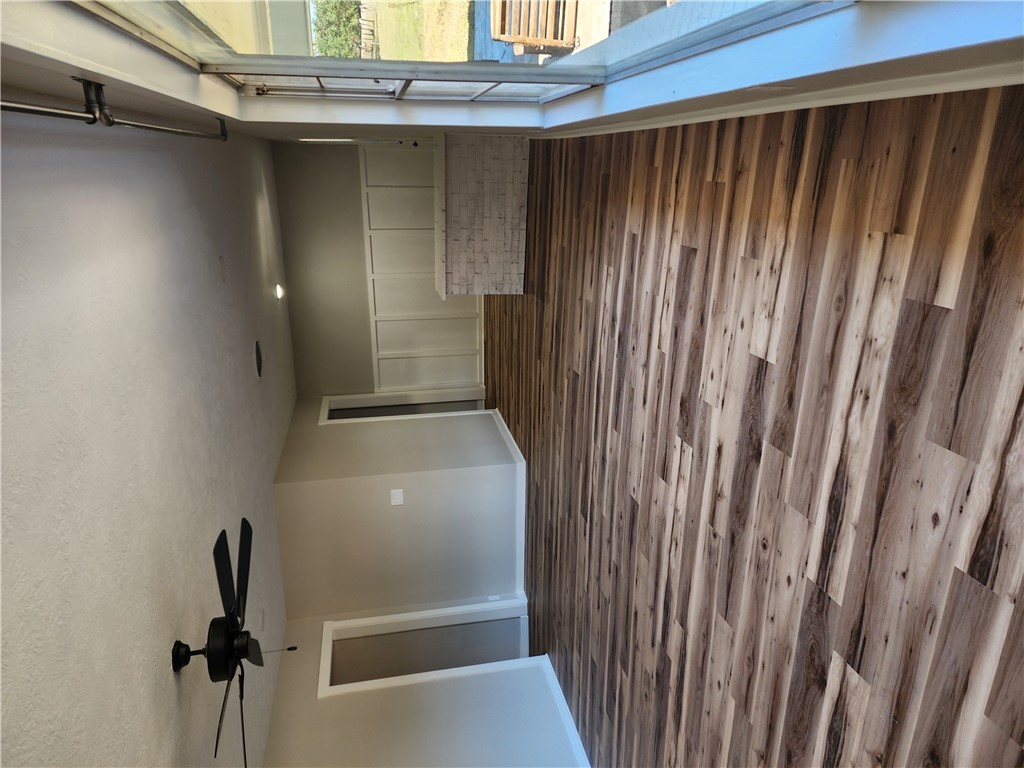 12877 East State Highway 21 Bryan, TX 77808 - Photo 5 of 48 a view of a room with wooden floor