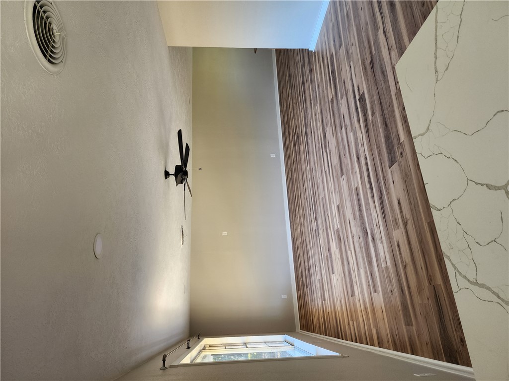 12877 East State Highway 21 Bryan, TX 77808 - Photo 6 of 48 en empty room with wooden floor