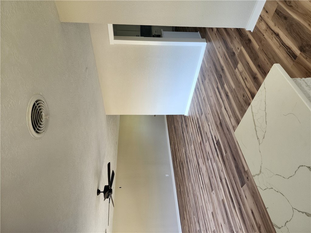 12877 East State Highway 21 Bryan, TX 77808 - Photo 7 of 48 a view of a room with wooden floor