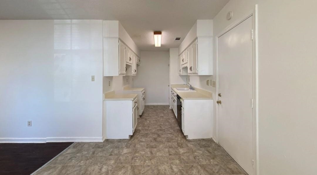 6659 Elmore Ridge Lane Memphis, TN 38134 - Photo 7 of 8 Kitchen with white cabinets and sink