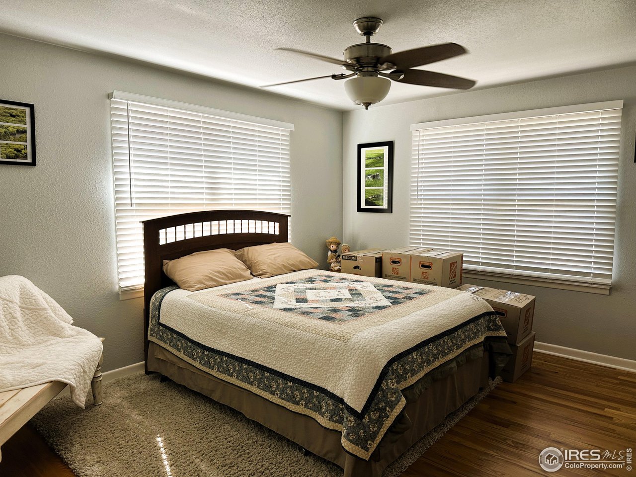 624 Fairhurst Street Sterling, CO 80751 - Photo 16 of 27 a white bed sitting in a bedroom next to a window