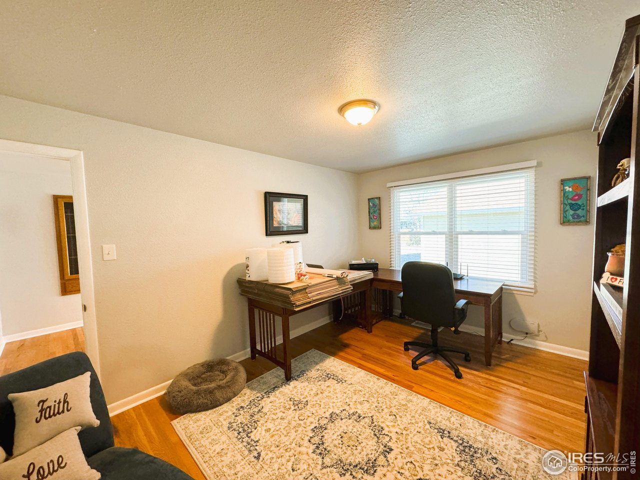 624 Fairhurst Street Sterling, CO 80751 - Photo 18 of 27 a view of a workspace with furniture and a window