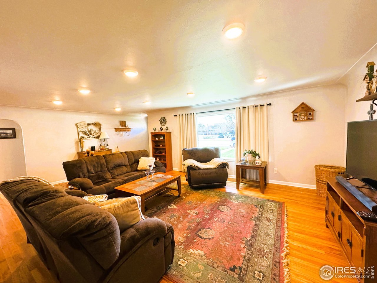 624 Fairhurst Street Sterling, CO 80751 - Photo 5 of 27 a bed room with a bed and a couch