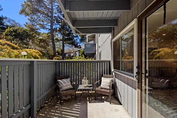 a view of balcony with two chairs