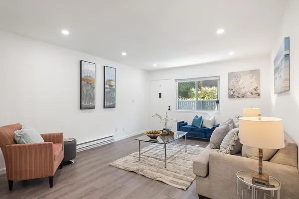 a living room with furniture and a window