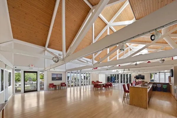 a view of a livingroom with furniture and hardwood floor
