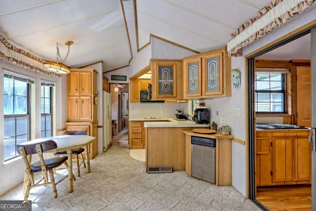 a kitchen with a stove and a refrigerator