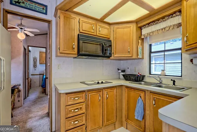 a kitchen that has a sink and a stove