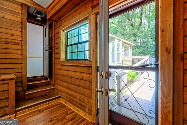 a kitchen with a sink a stove cabinets and a window