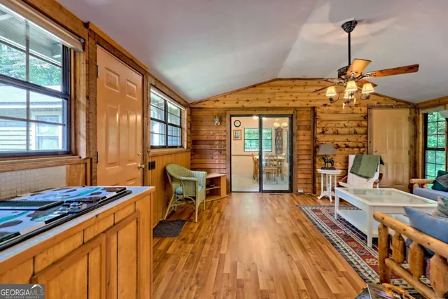 a kitchen with stainless steel appliances granite countertop a refrigerator a stove top oven a sink and dishwasher