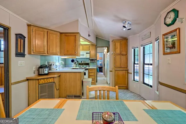 a view of a balcony with furniture and floor to ceiling window