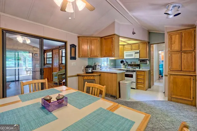 a view of a chair and tables in the balcony