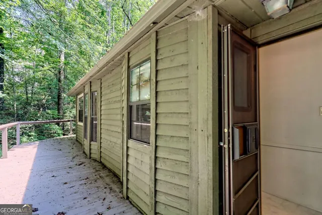 an aerial view of a house with a big yard