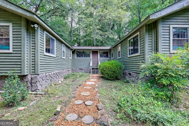 a backyard of a house with lots of green space