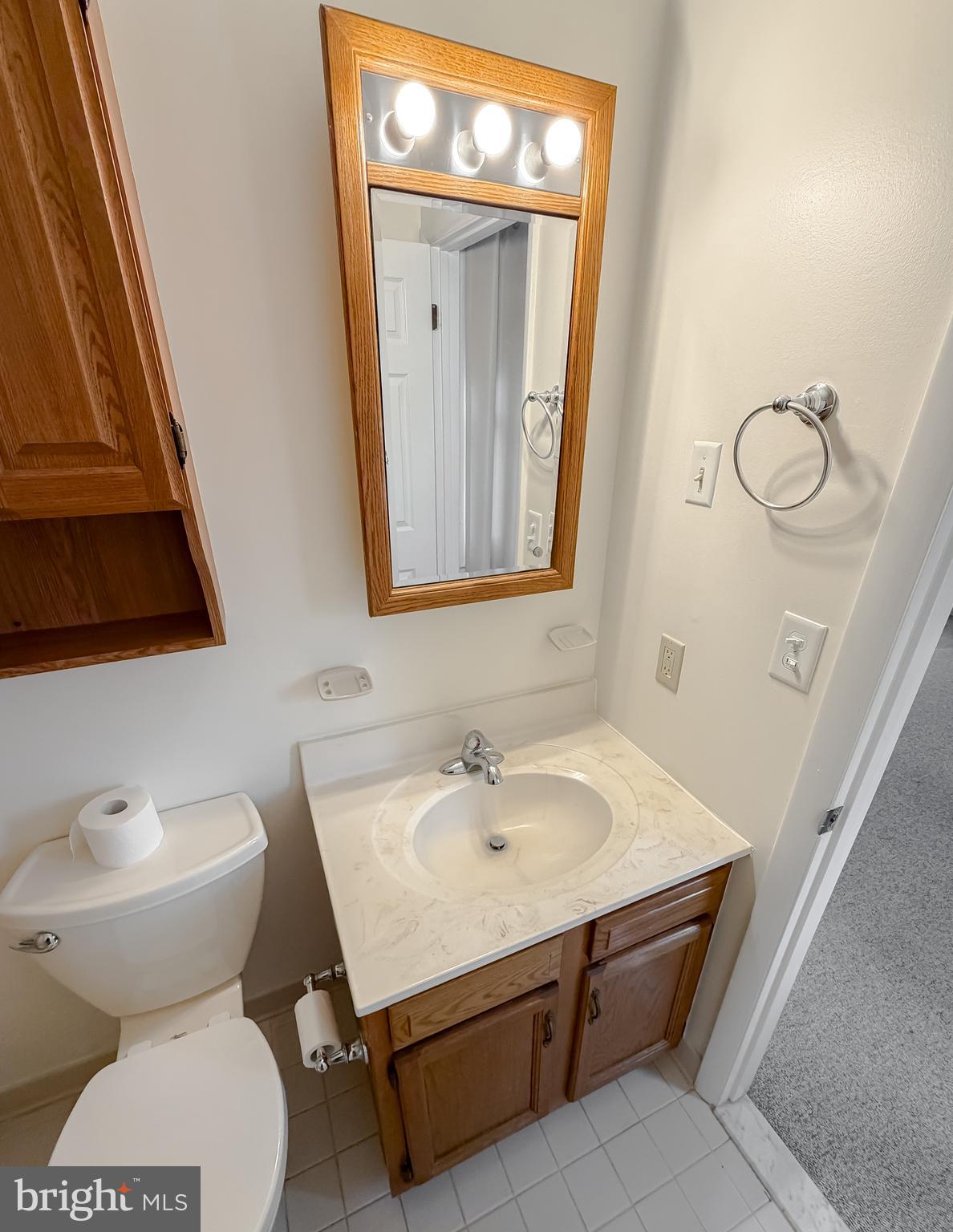 7615 Mill Creek Road Benedict, MD 20612 - Photo 19 of 37 a bathroom with a sink and a mirror