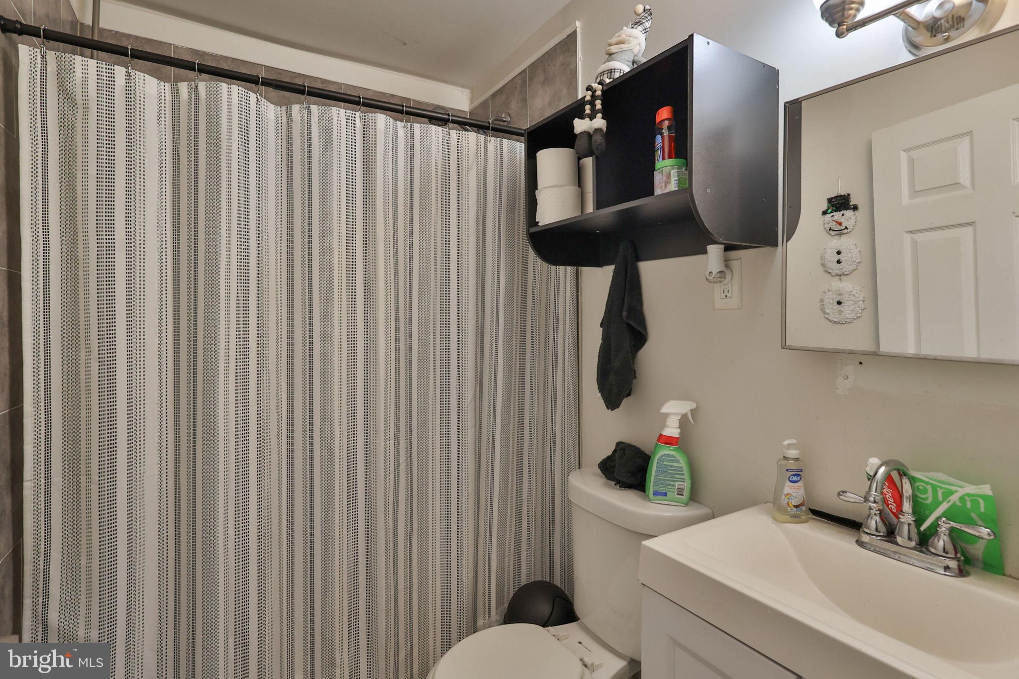 708 Ward Street Chester, PA 19013 - Photo 11 of 44 a bathroom with a sink and a mirror