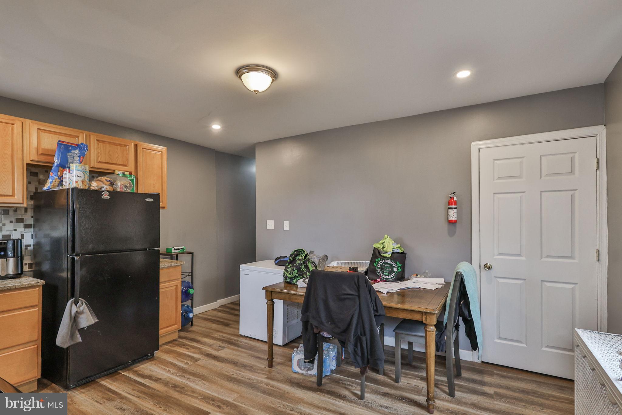 708 Ward Street Chester, PA 19013 - Photo 17 of 44 a view of a dining room with furniture window and wooden floor