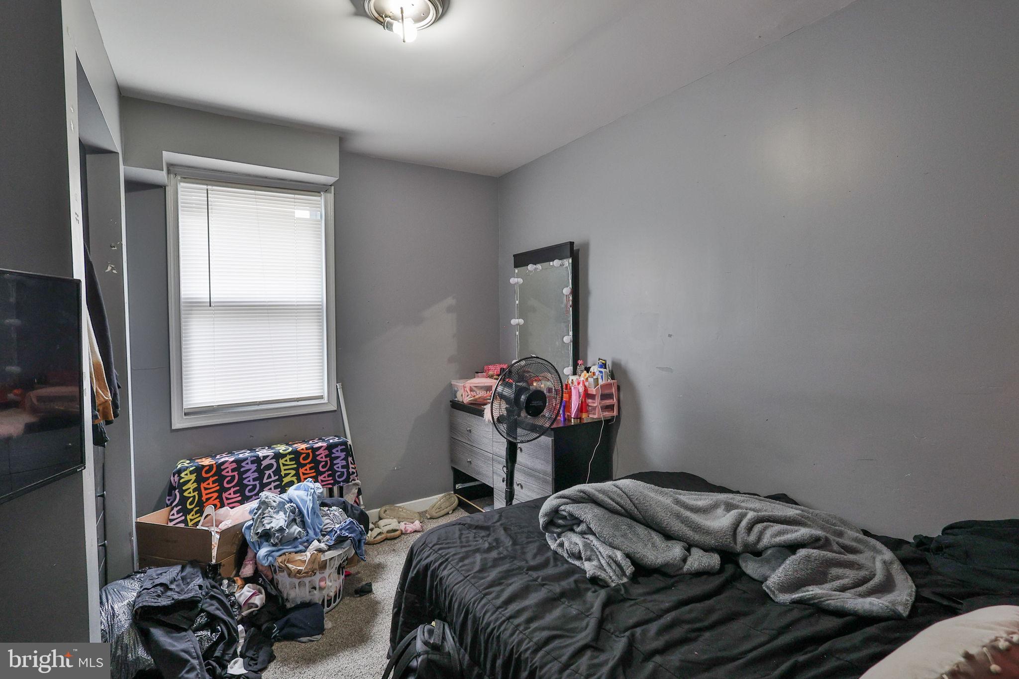 708 Ward Street Chester, PA 19013 - Photo 18 of 44 a bedroom with bed and a window