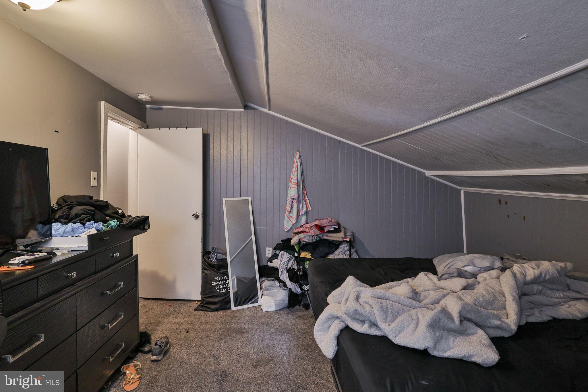 708 Ward Street Chester, PA 19013 - Photo 23 of 44 a bedroom with bed and a window