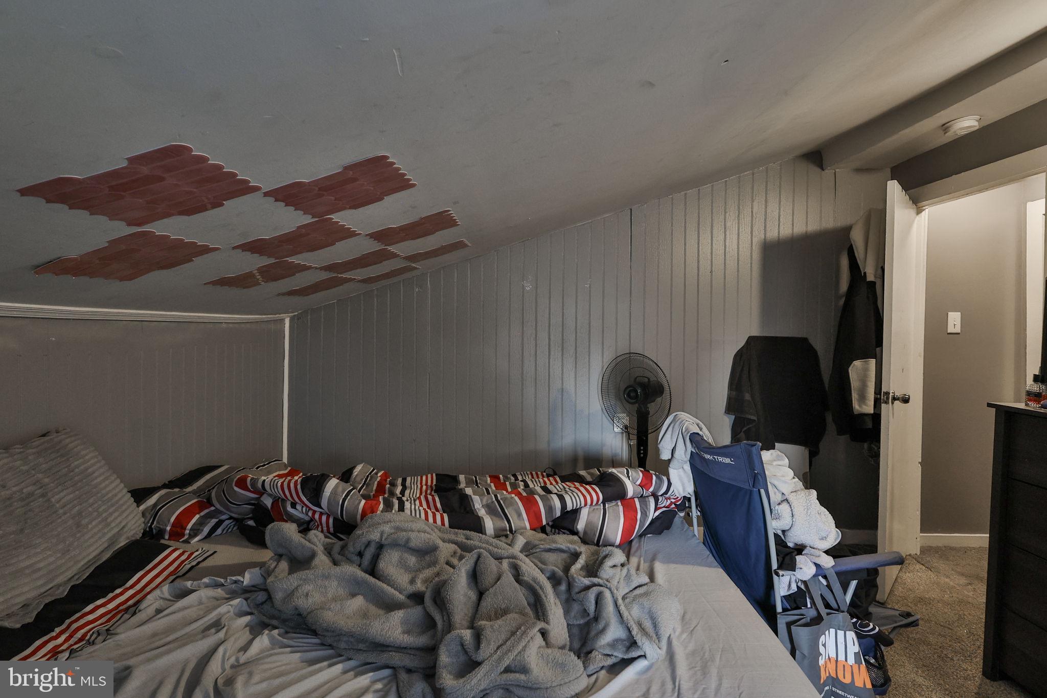 708 Ward Street Chester, PA 19013 - Photo 26 of 44 a bed room with a bed and a dresser