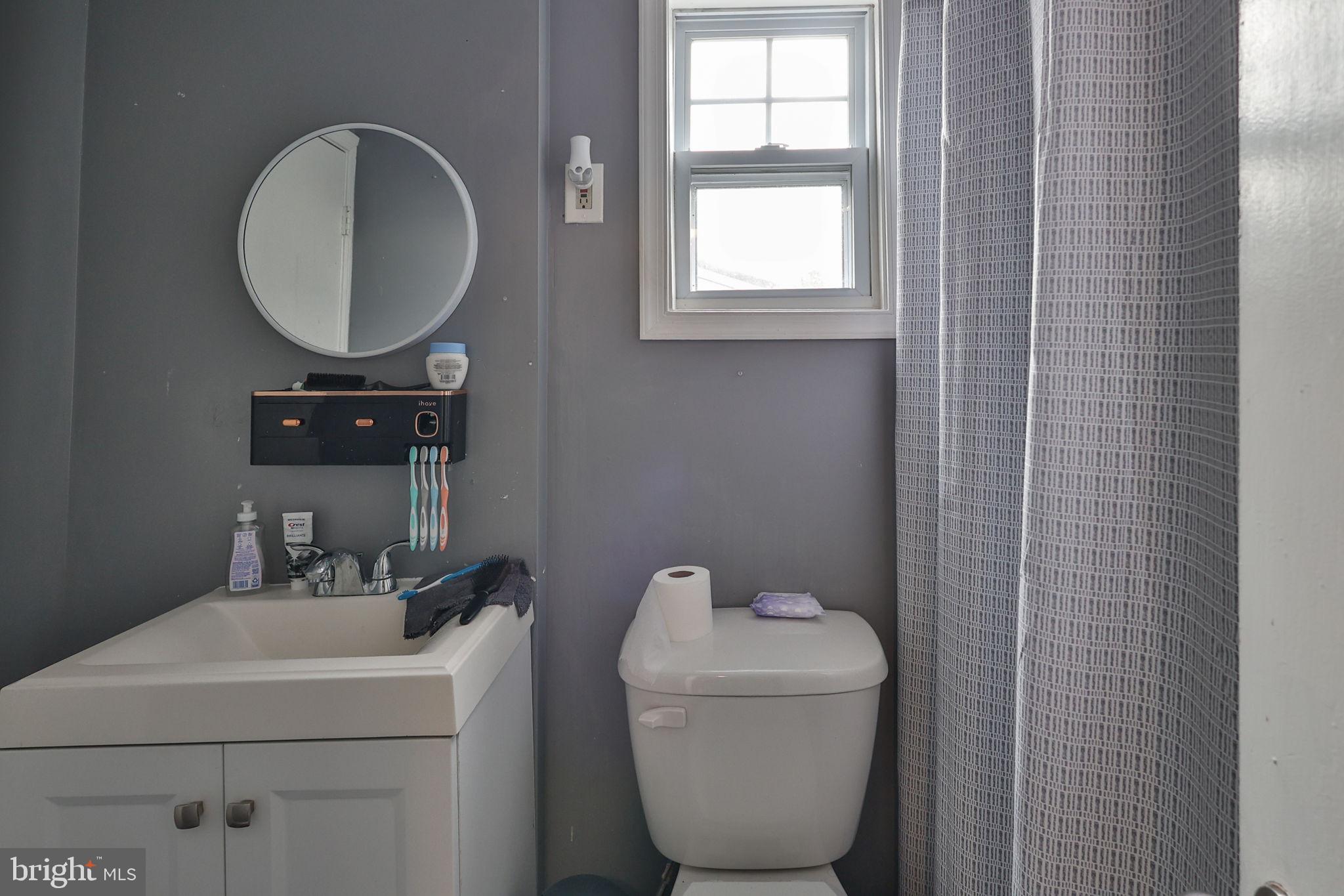 708 Ward Street Chester, PA 19013 - Photo 28 of 44 a bathroom with a toilet and a sink