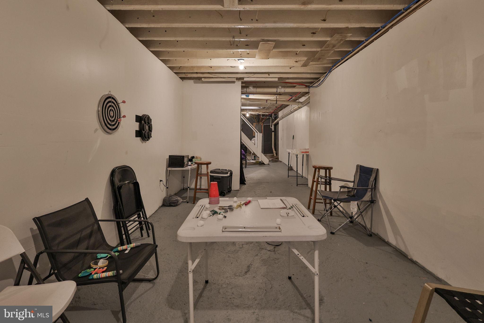 708 Ward Street Chester, PA 19013 - Photo 35 of 44 a view of a dining room with furniture and a chandelier