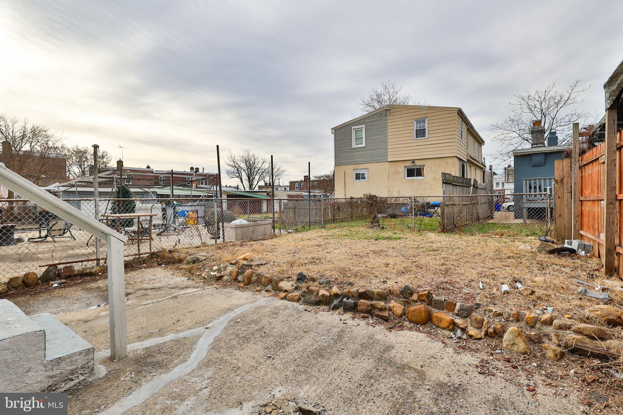 708 Ward Street Chester, PA 19013 - Photo 40 of 44 a view of a white house next to a yard with road and buildings