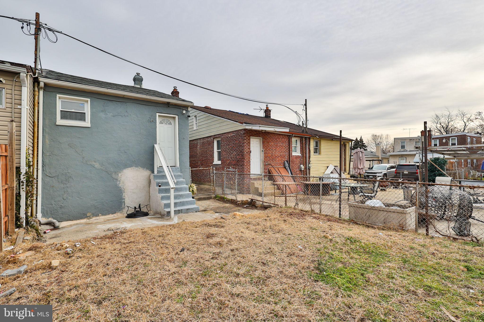 708 Ward Street Chester, PA 19013 - Photo 43 of 44 a backyard of a house with table and chairs
