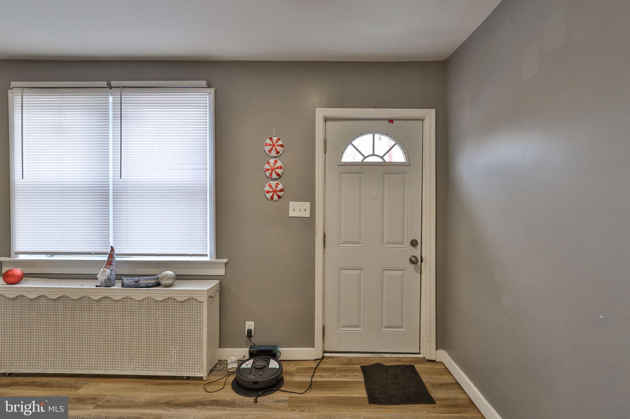 708 Ward Street Chester, PA 19013 - Photo 5 of 44 a view of front door with wooden floor