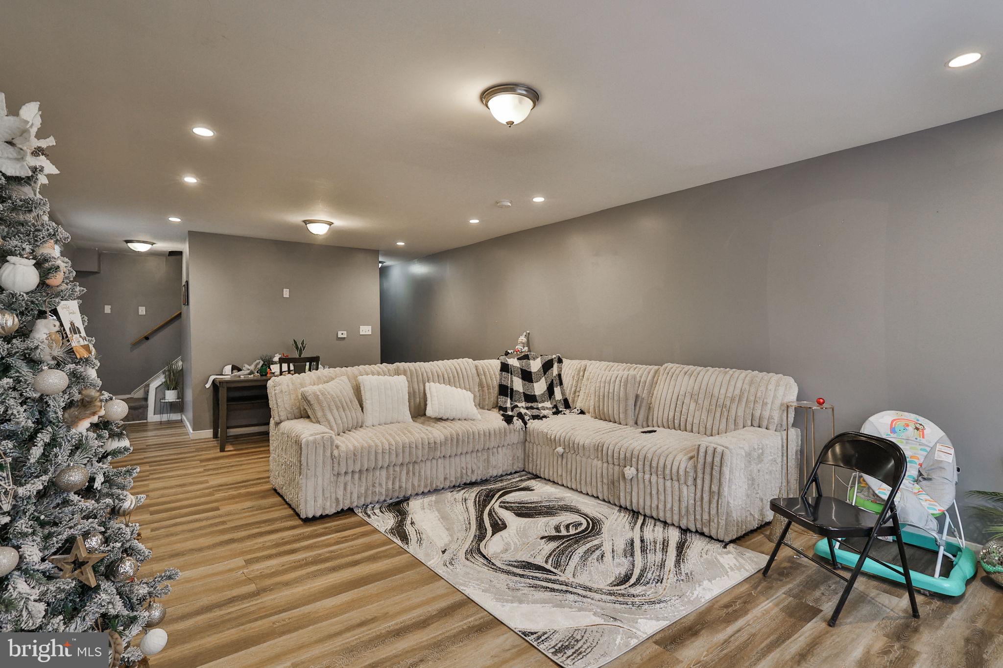 708 Ward Street Chester, PA 19013 - Photo 6 of 44 a living room with furniture and wooden floor